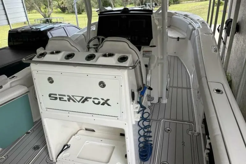  Yacht Photos Pics 2021 Sea Fox 288 Commander boat interior with seating and control panel.