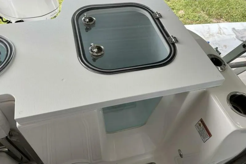  Yacht Photos Pics 2021 Sea Fox 288 Commander boat with a closed hatch and visible storage compartment.