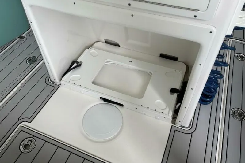  Yacht Photos Pics 2021 Sea Fox 288 Commander boat interior with storage compartment and deck details.