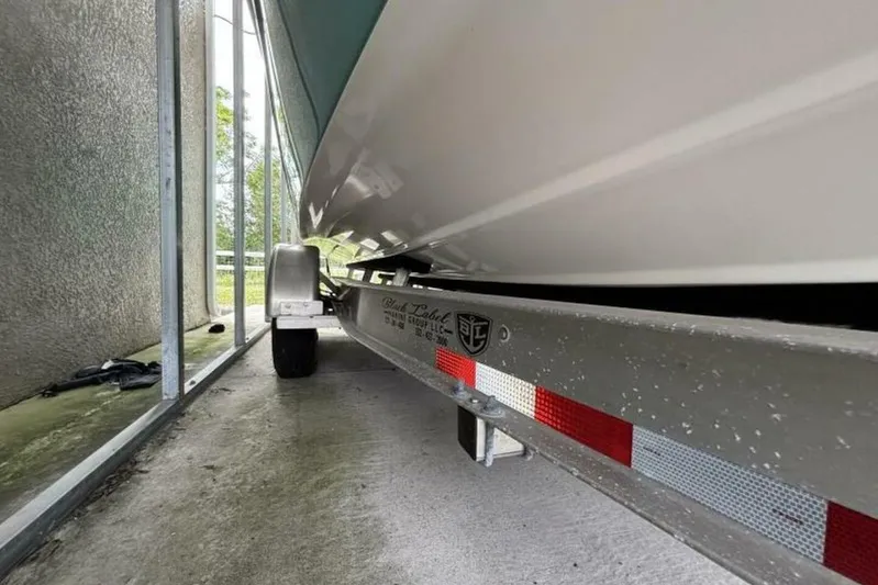  Yacht Photos Pics 2021 Sea Fox 288 Commander boat on trailer, parked in a covered area.