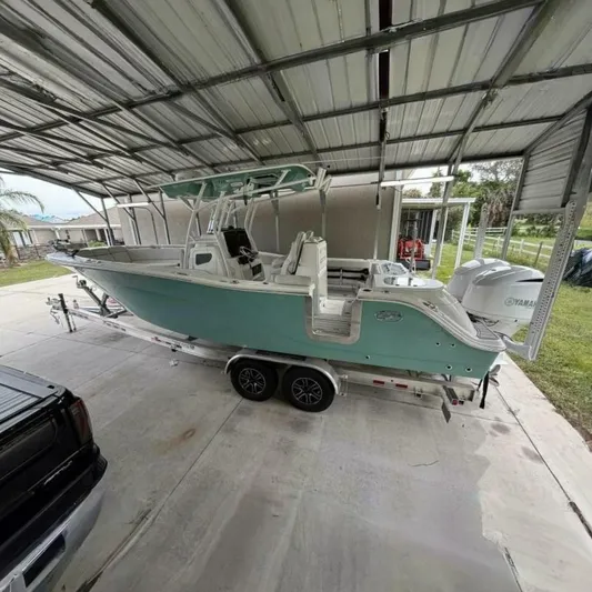  Yacht Photos Pics 2021 Sea Fox 288 Commander boat on trailer under metal canopy.