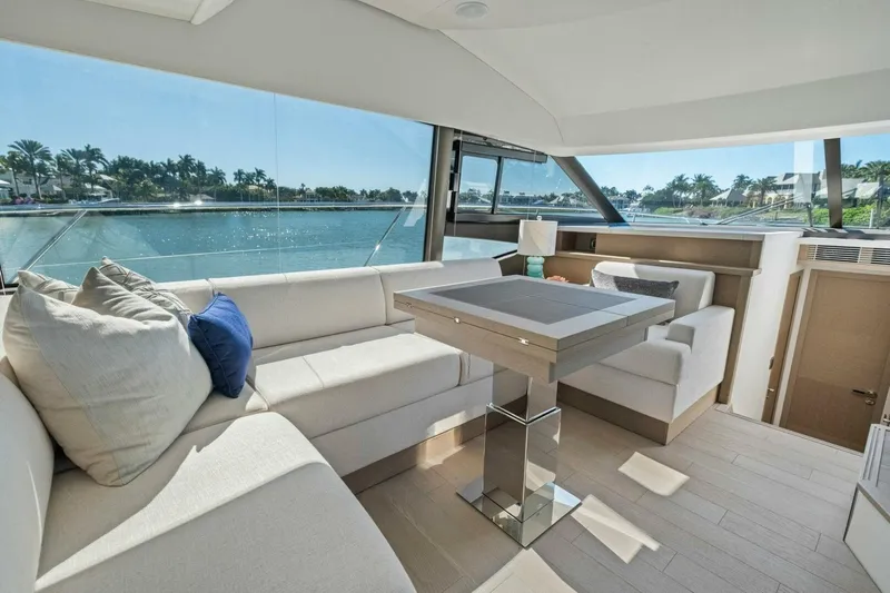 No Patience Yacht Photos Pics Luxurious interior of 2022 Prestige 520 yacht with elegant seating and scenic water view.