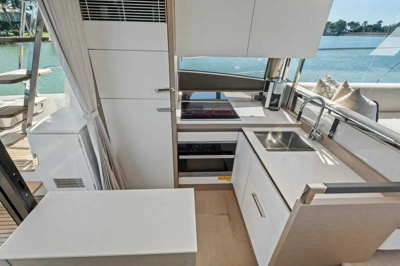 No Patience Yacht Photos Pics Modern kitchen interior on 2022 Prestige 520 yacht with sleek design and waterfront view.