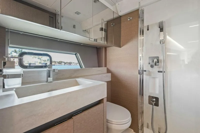 No Patience Yacht Photos Pics Luxurious bathroom in 2022 Prestige 520 yacht with modern fixtures and ocean view.