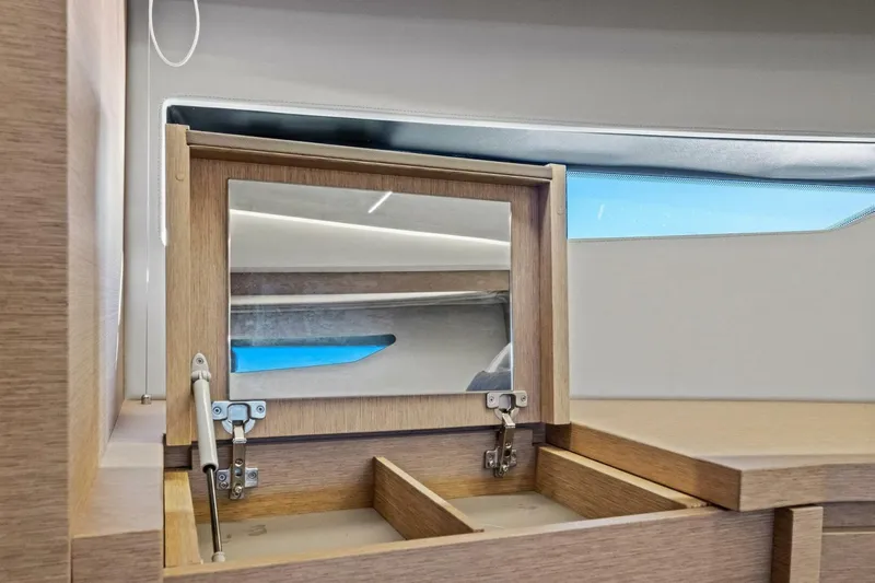 No Patience Yacht Photos Pics Luxury interior of 2022 Prestige 520 yacht with wooden vanity and mirror.