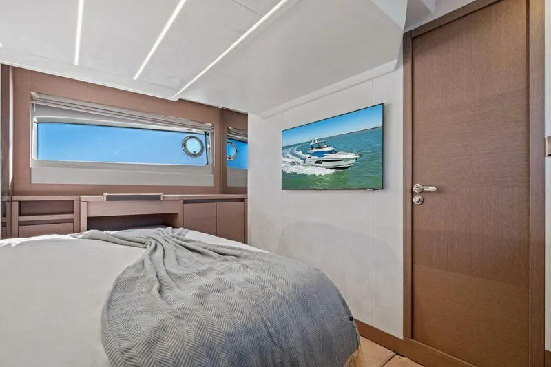 No Patience Yacht Photos Pics Luxurious 2022 Prestige 520 yacht interior with modern bedroom and scenic ocean view.