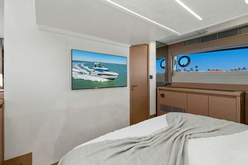 No Patience Yacht Photos Pics Luxurious 2022 Prestige 520 yacht interior with modern bedroom and ocean view.
