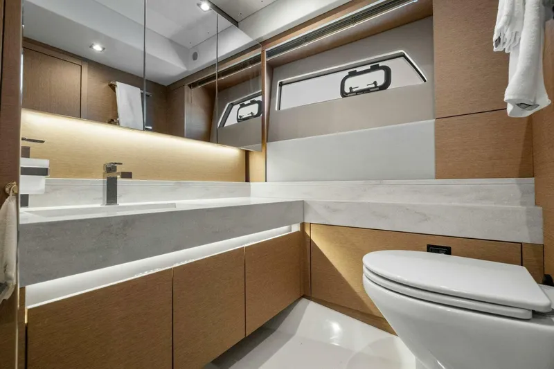 No Patience Yacht Photos Pics Luxurious bathroom interior of 2022 Prestige 520 yacht with modern fixtures and elegant design.