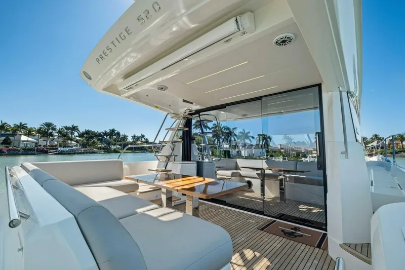 No Patience Yacht Photos Pics Luxury 2022 Prestige 520 yacht with spacious deck and elegant seating area.