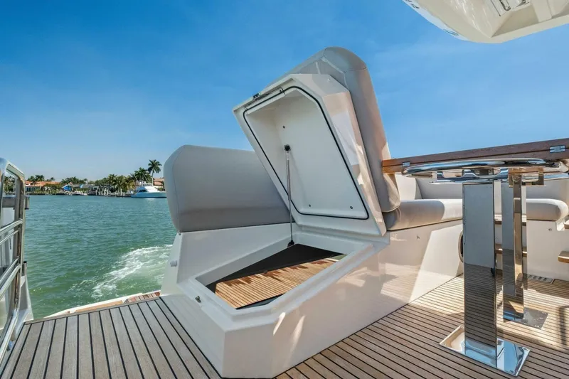 No Patience Yacht Photos Pics Luxury 2022 Prestige 520 yacht with open storage, sleek design, and scenic water view.