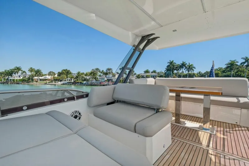 No Patience Yacht Photos Pics Luxurious 2022 Prestige 520 yacht interior with elegant seating and scenic waterfront view.