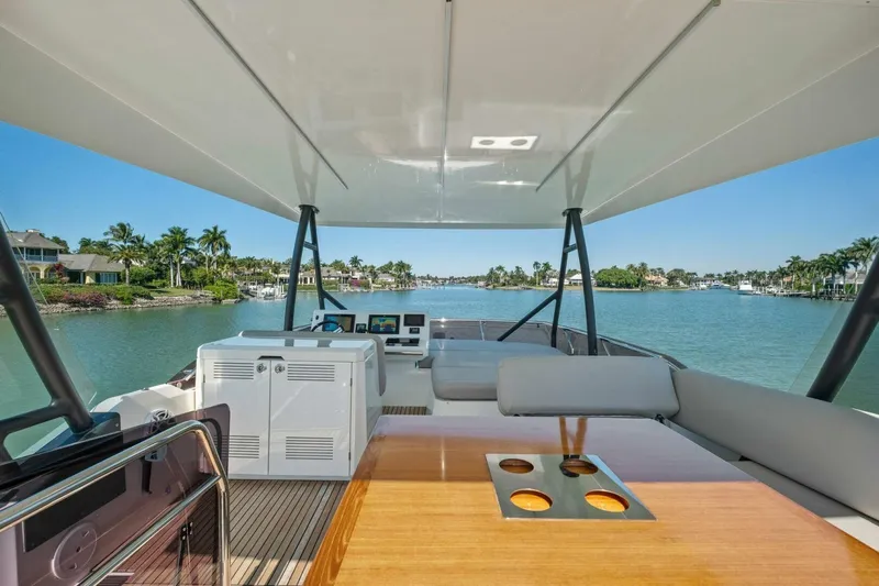 No Patience Yacht Photos Pics Luxurious 2022 Prestige 520 yacht interior with scenic waterfront view.