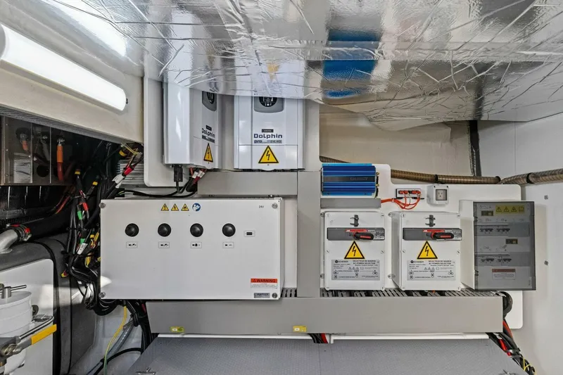 No Patience Yacht Photos Pics Electrical system of a 2022 Prestige 520 yacht, featuring control panels and wiring.