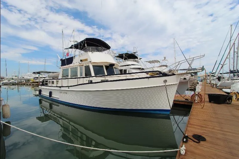  Yacht Photos Pics 1989 Grand Banks Classic yacht docked at marina under blue sky.