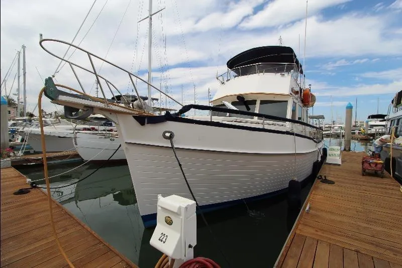  Yacht Photos Pics 1989 Grand Banks Classic yacht docked at marina under blue sky.