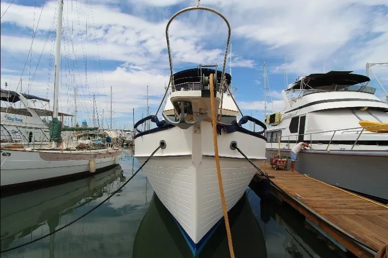  Yacht Photos Pics 1989 Grand Banks Classic yacht docked at marina under blue sky.