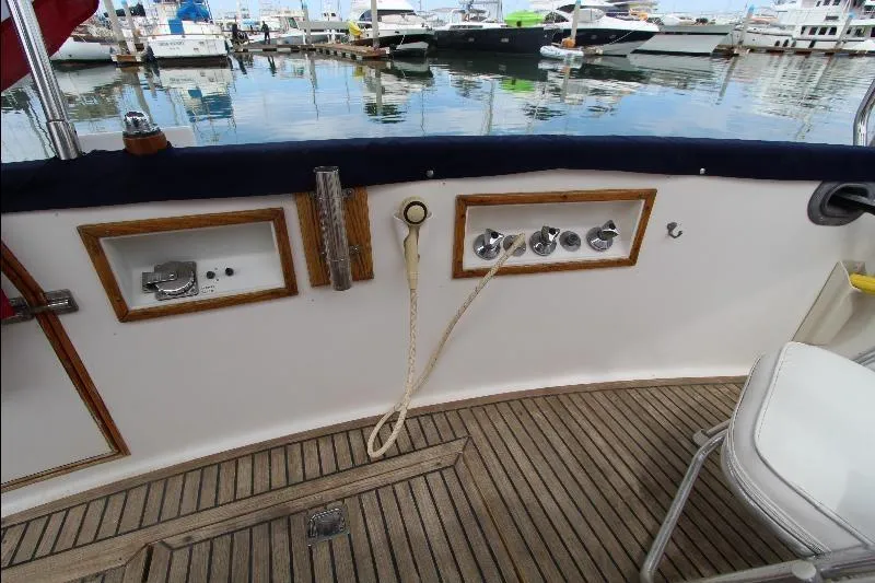  Yacht Photos Pics 1989 Grand Banks Classic yacht deck with controls, docked at marina.