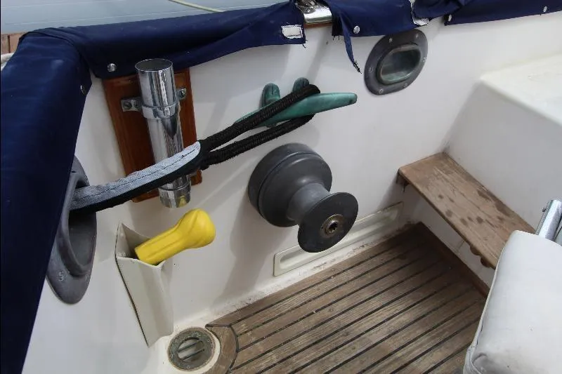  Yacht Photos Pics 1989 Grand Banks Classic boat deck with winch, ropes, and wooden flooring.