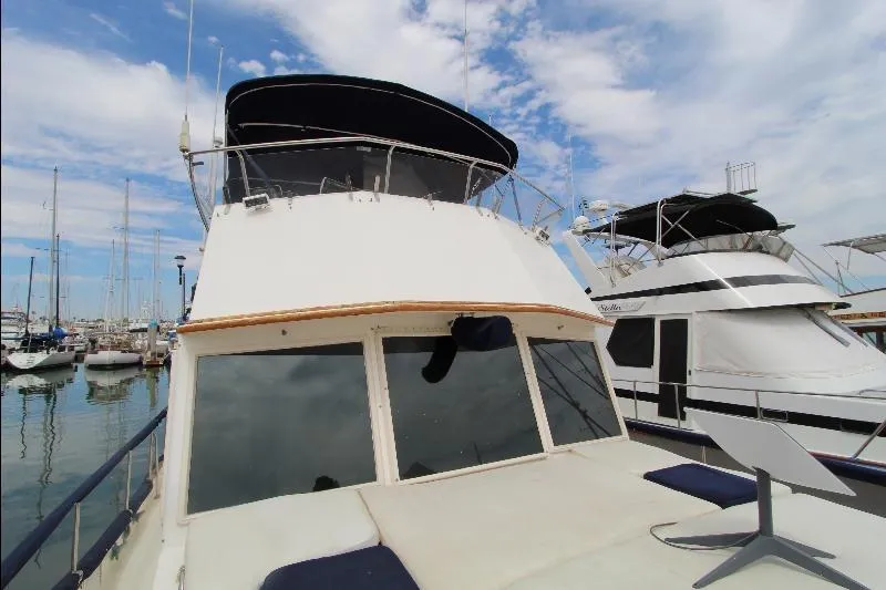  Yacht Photos Pics 1989 Grand Banks Classic yacht docked at marina under blue sky.