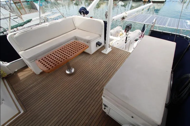  Yacht Photos Pics 1989 Grand Banks Classic yacht deck with seating and wooden table.