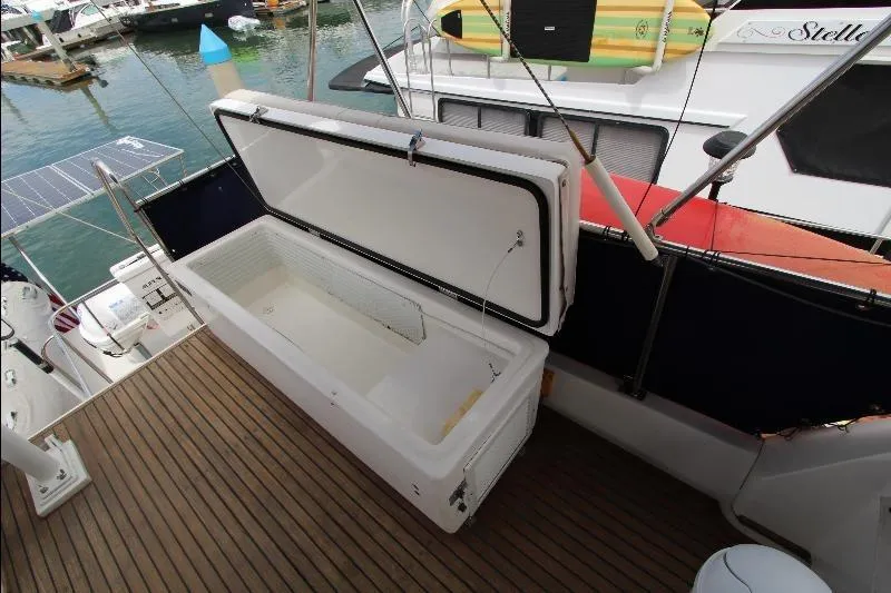  Yacht Photos Pics Open storage compartment on 1989 Grand Banks Classic boat deck, docked at marina.