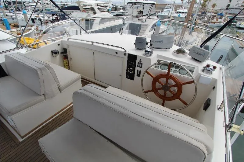  Yacht Photos Pics 1989 Grand Banks Classic yacht helm with wooden wheel and Garmin navigation systems.