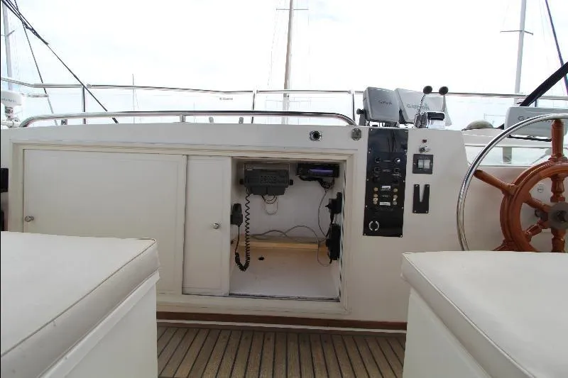  Yacht Photos Pics 1989 Grand Banks Classic yacht helm with wooden wheel and control panel.