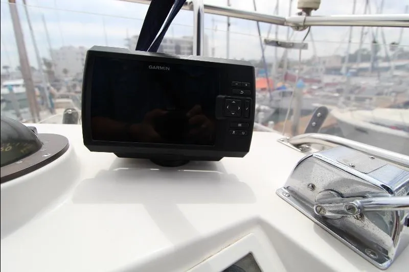  Yacht Photos Pics Garmin navigation system on 1989 Grand Banks Classic yacht dashboard in marina.