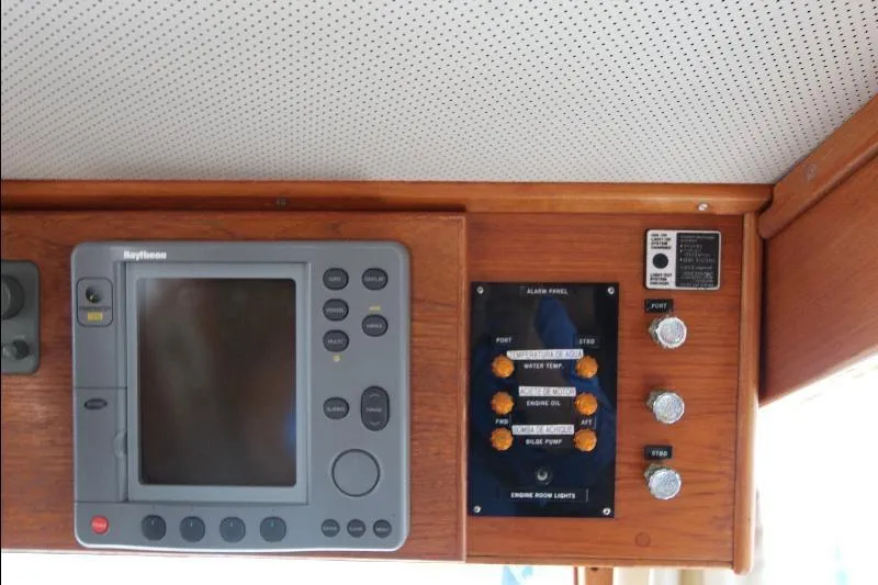  Yacht Photos Pics Control panel of a 1989 Grand Banks Classic boat with navigation and alarm systems.