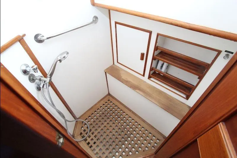  Yacht Photos Pics 1989 Grand Banks Classic yacht shower with wooden accents and stainless steel fixtures.