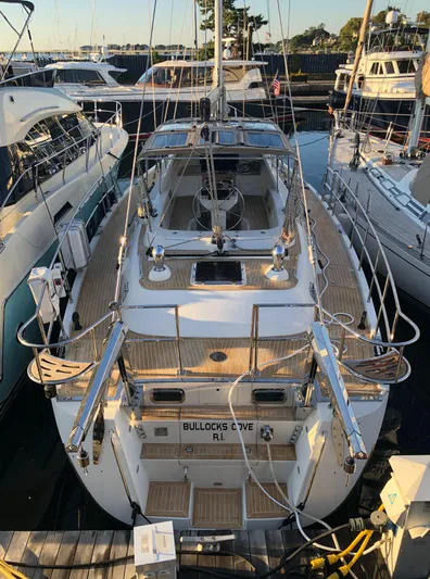 Pneumatic Yacht Photos Pics Outbound 56 sailboat docked at marina, 2020 model, surrounded by other boats.
