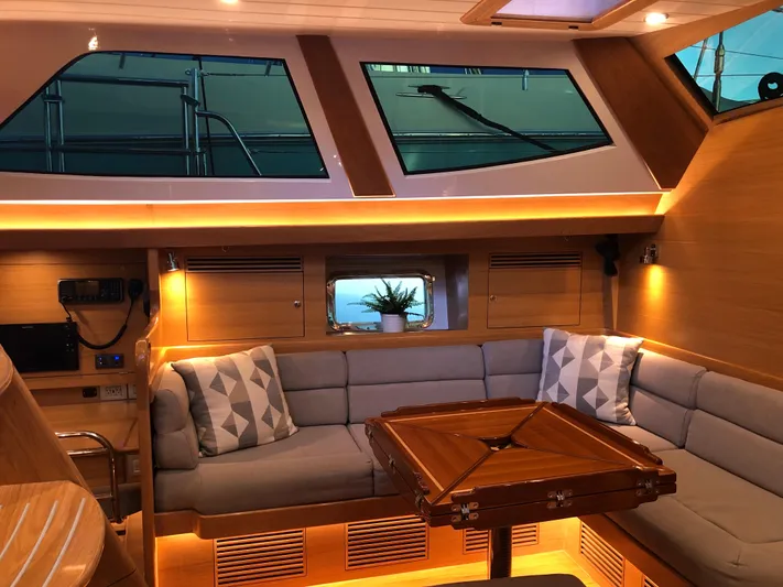 Pneumatic Yacht Photos Pics Luxurious interior of 2020 Outbound 56 yacht with cozy seating and elegant lighting.