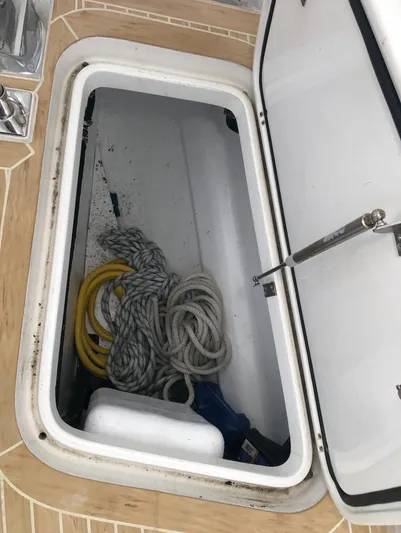 Pneumatic Yacht Photos Pics Open storage compartment on 2020 Outbound 56 boat with ropes and equipment.