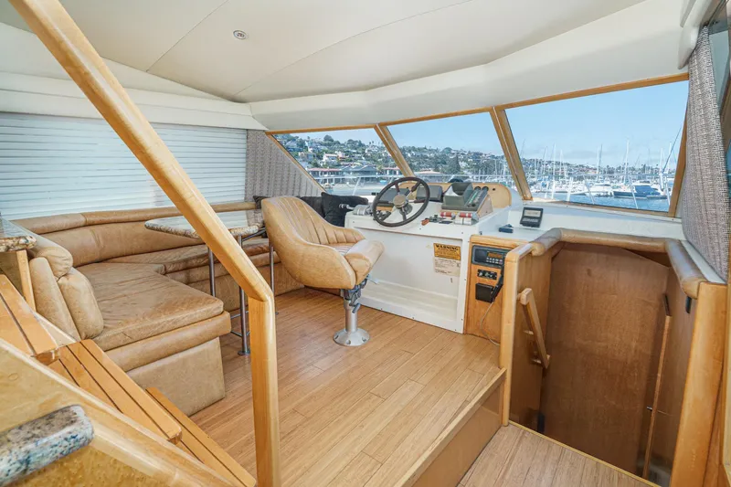 Shady Lady Yacht Photos Pics Interior of a 1995 Navigator Classic yacht with helm and seating area.