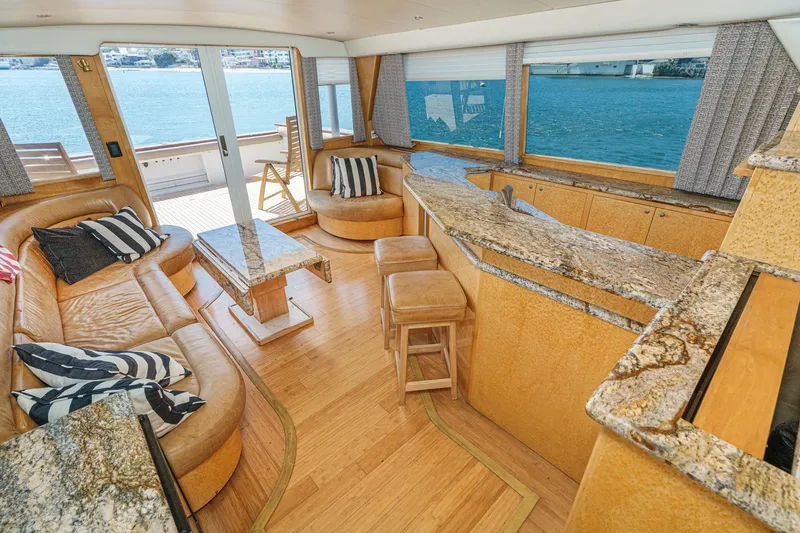 Shady Lady Yacht Photos Pics Luxurious 1995 Navigator Classic yacht interior with leather seating, granite countertops, and ocean view.