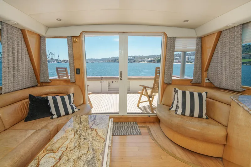 Shady Lady Yacht Photos Pics Luxurious 1995 Navigator Classic yacht interior with leather seating and ocean view.