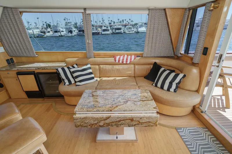 Shady Lady Yacht Photos Pics Luxurious 1995 Navigator Classic yacht interior with leather seating and marina view.