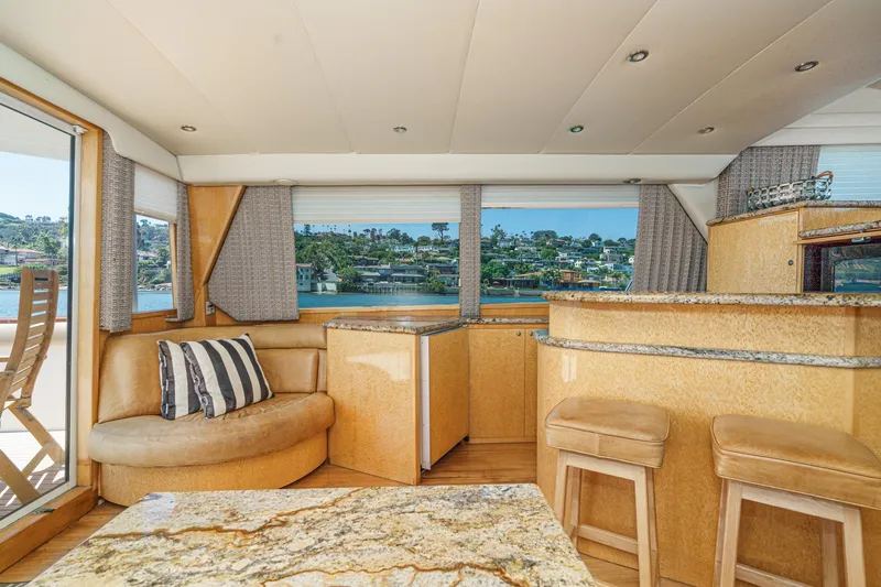 Shady Lady Yacht Photos Pics Interior of 1995 Navigator Classic yacht with elegant seating and scenic window view.