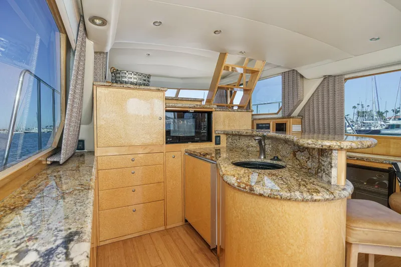 Shady Lady Yacht Photos Pics Luxurious 1995 Navigator Classic yacht interior with granite countertops and wooden cabinetry.