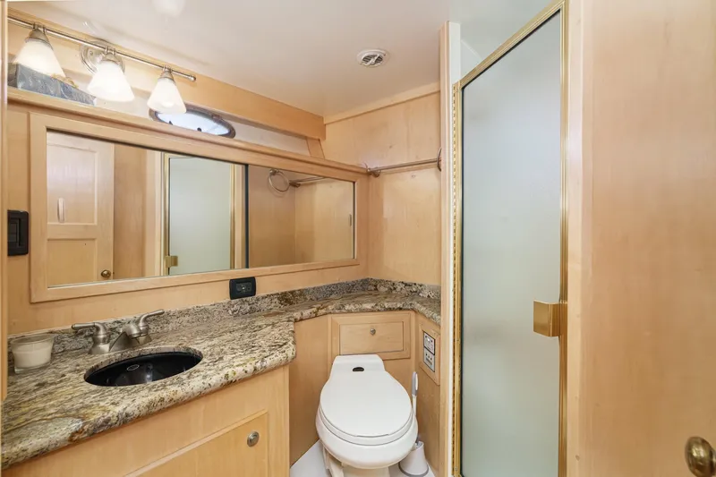 Shady Lady Yacht Photos Pics Luxurious 1995 Navigator Classic yacht bathroom with granite countertop and modern fixtures.