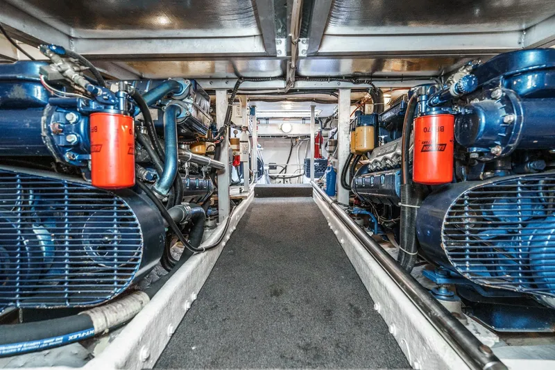 Shady Lady Yacht Photos Pics Engine room of a 1995 Navigator Classic yacht, showcasing dual engines and mechanical components.