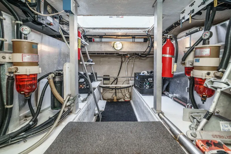 Shady Lady Yacht Photos Pics Engine room of a 1995 Navigator Classic yacht with equipment and fire extinguishers.