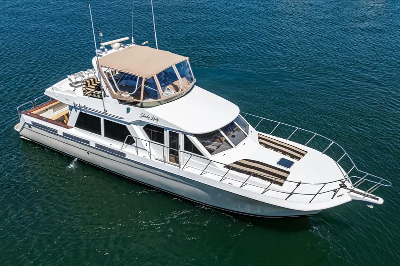 Shady Lady Yacht Photos Pics 1995 Navigator Classic yacht on open water, featuring a sleek design and spacious deck.