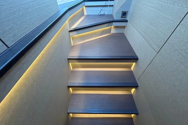  Yacht Photos Pics Illuminated wooden stairs inside a 2018 Prestige 680S yacht.