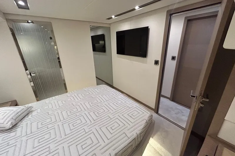  Yacht Photos Pics Luxurious bedroom interior of 2018 Prestige 680S yacht with modern decor and amenities.