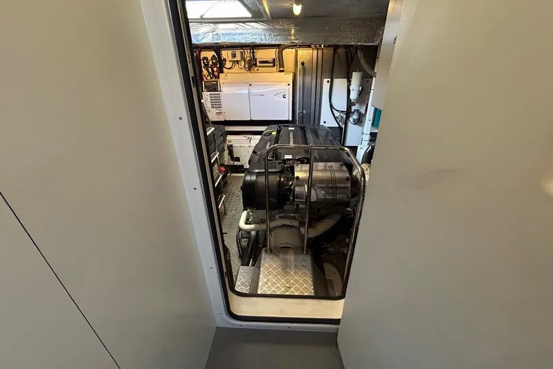  Yacht Photos Pics Engine room of a 2018 Prestige 680S yacht, showcasing machinery and equipment.