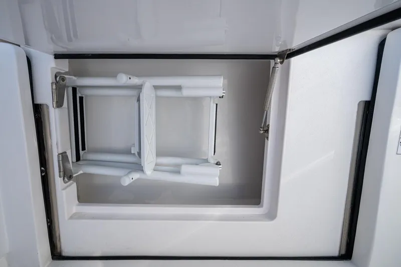Karey Lee Yacht Photos Pics 2024 Intrepid 477 Evolution boat compartment with foldable ladder.