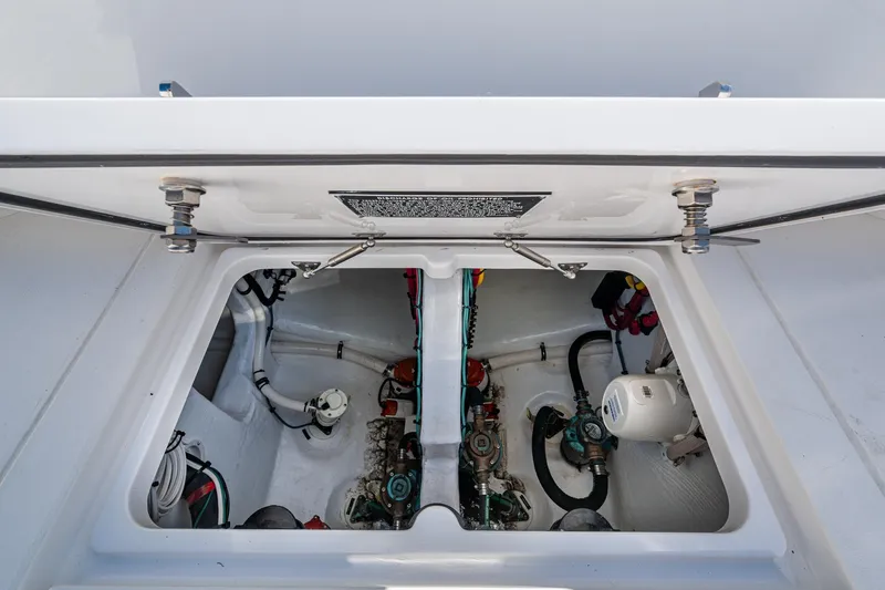 Karey Lee Yacht Photos Pics Engine compartment of 2024 Intrepid 477 Evolution boat, showcasing mechanical components.
