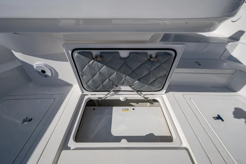 Karey Lee Yacht Photos Pics 2024 Intrepid 477 Evolution boat storage compartment with open hatch.