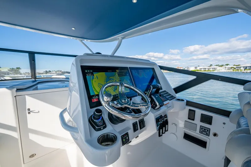 Karey Lee Yacht Photos Pics 2024 Intrepid 477 Evolution helm with advanced navigation displays and controls.